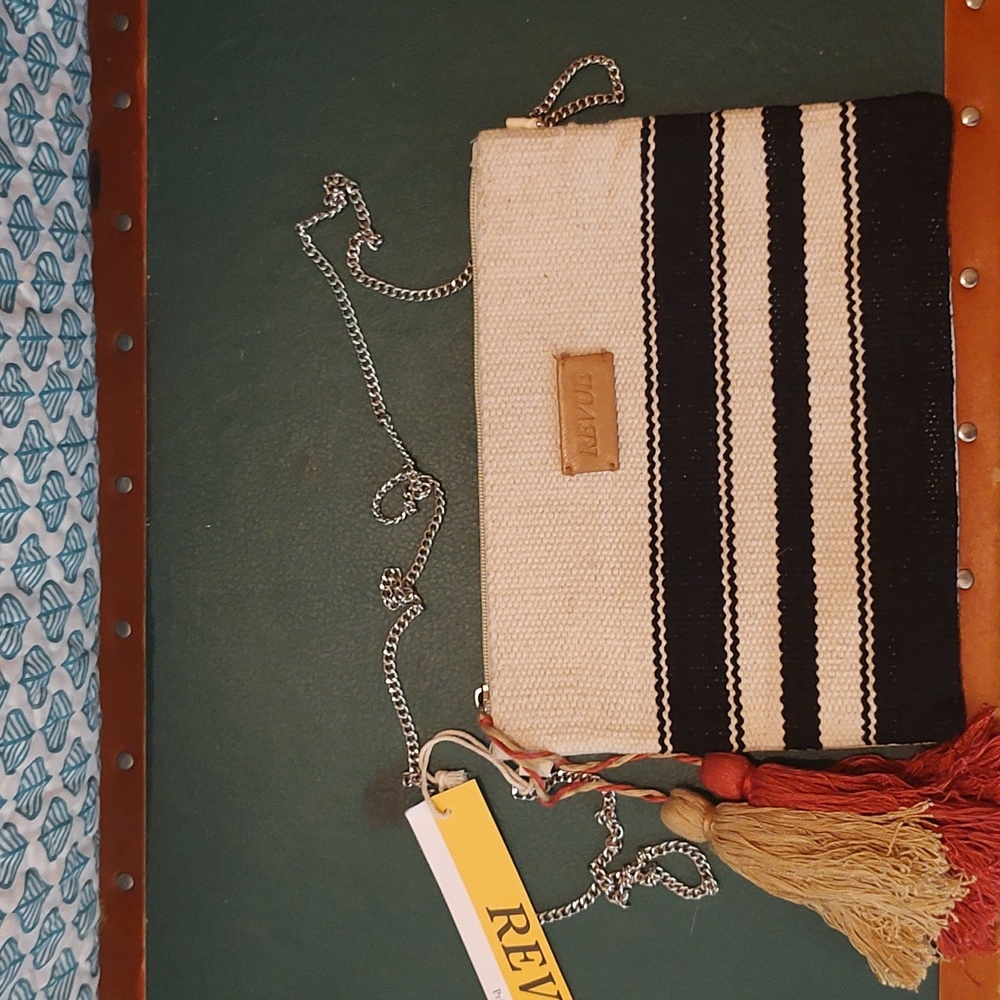 Bohemian purse made of cloth with a chain strap. Crossbody bag